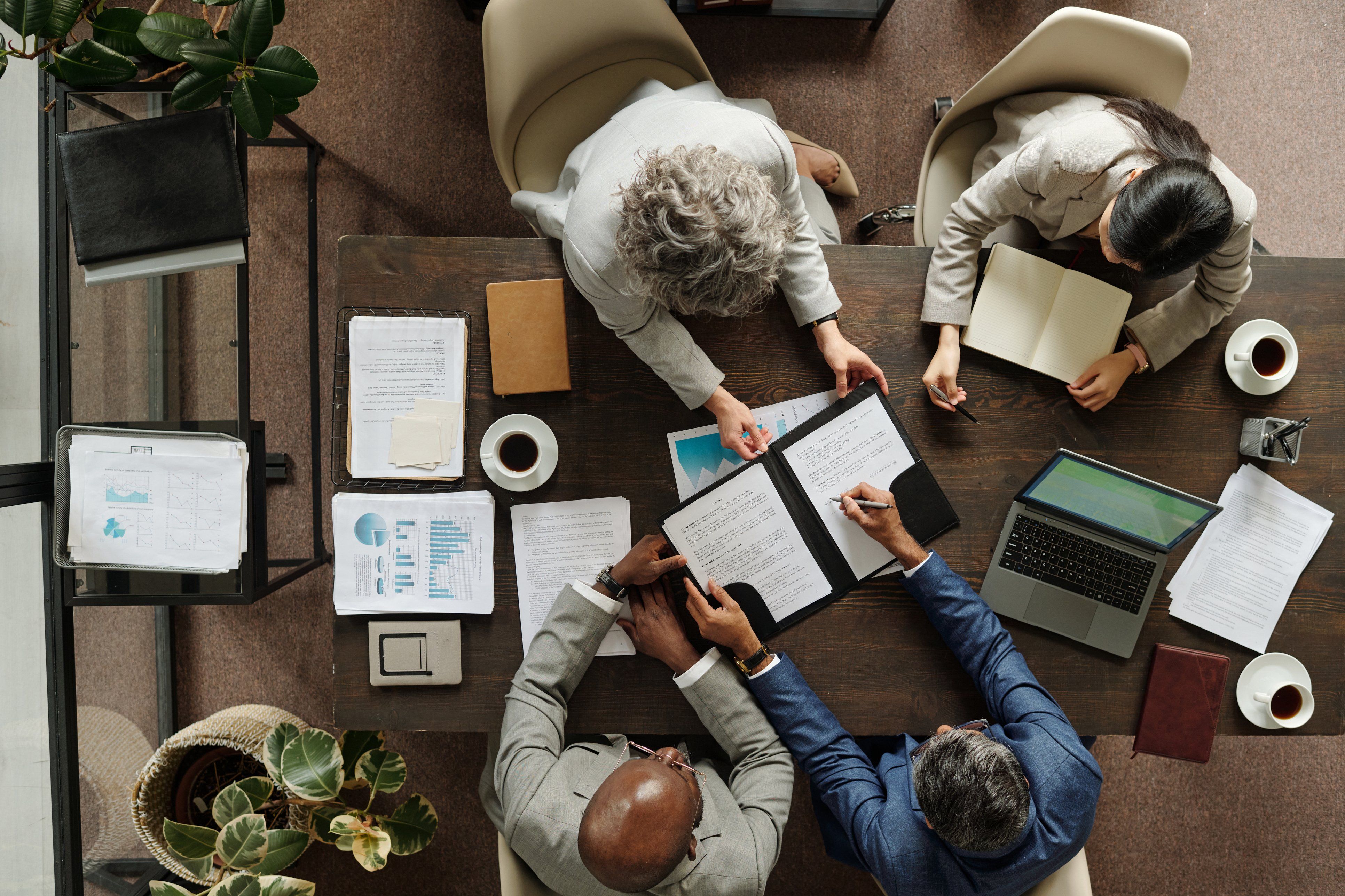 Business professionals reviewing financial documents together.